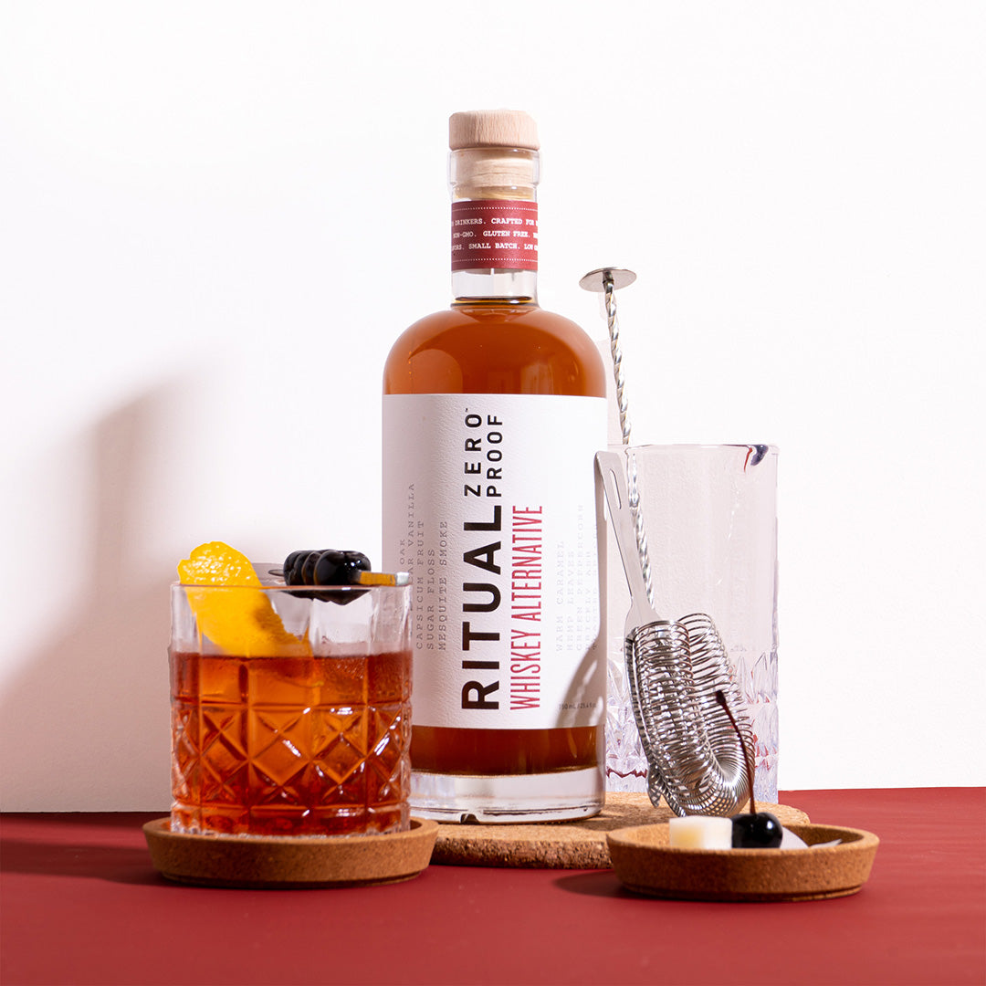 “Ritual Zero Proof Whiskey Alternative bottle – non-alcoholic whiskey”
“Non-alcoholic bourbon substitute for cocktails – Ritual Whiskey Alternative”
“Ritual Zero Proof whiskey bottle on bar cart with glass and garnish