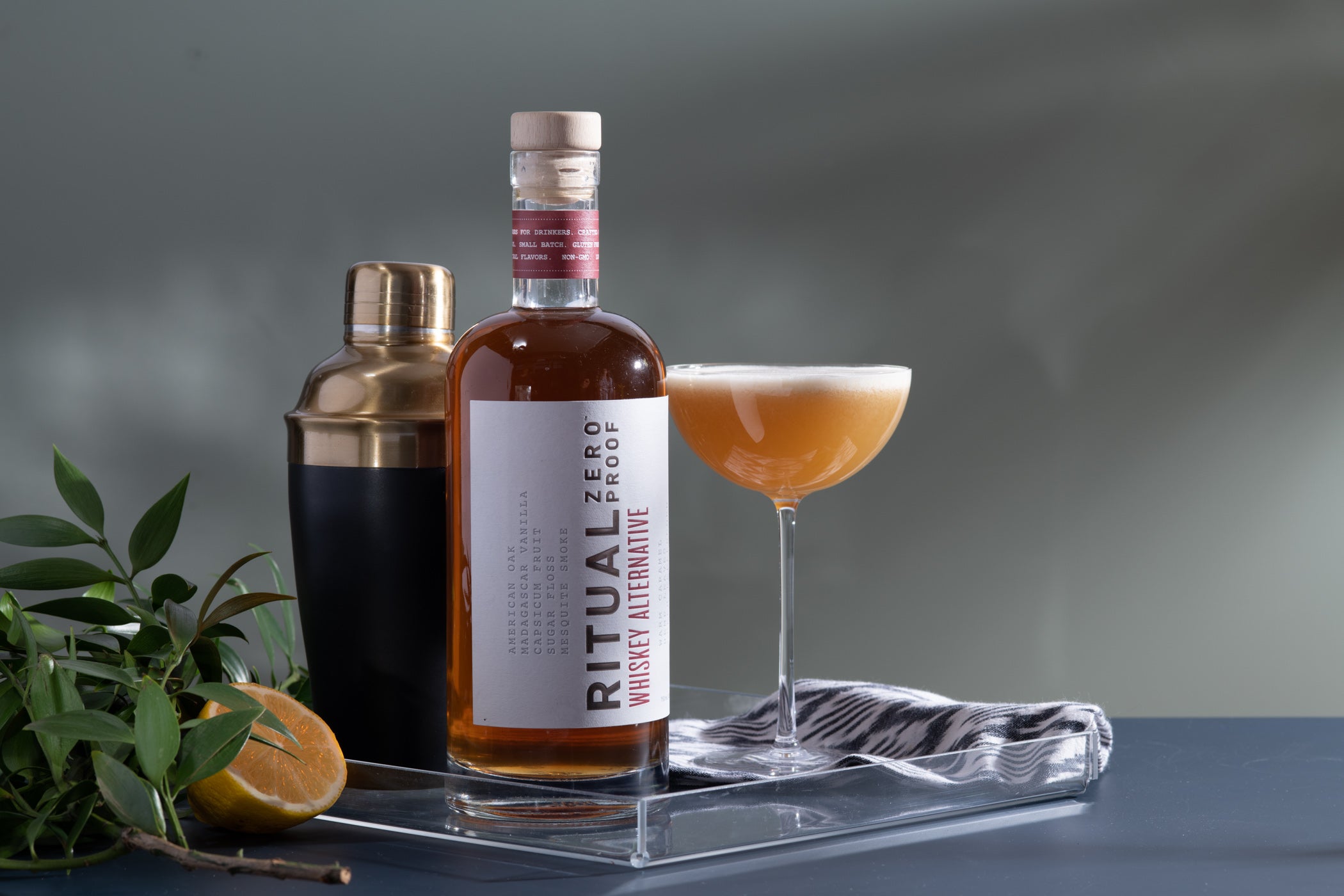 “Ritual Zero Proof Whiskey Alternative bottle – non-alcoholic whiskey”
“Non-alcoholic bourbon substitute for cocktails – Ritual Whiskey Alternative”
“Ritual Zero Proof whiskey bottle on bar cart with glass and garnish